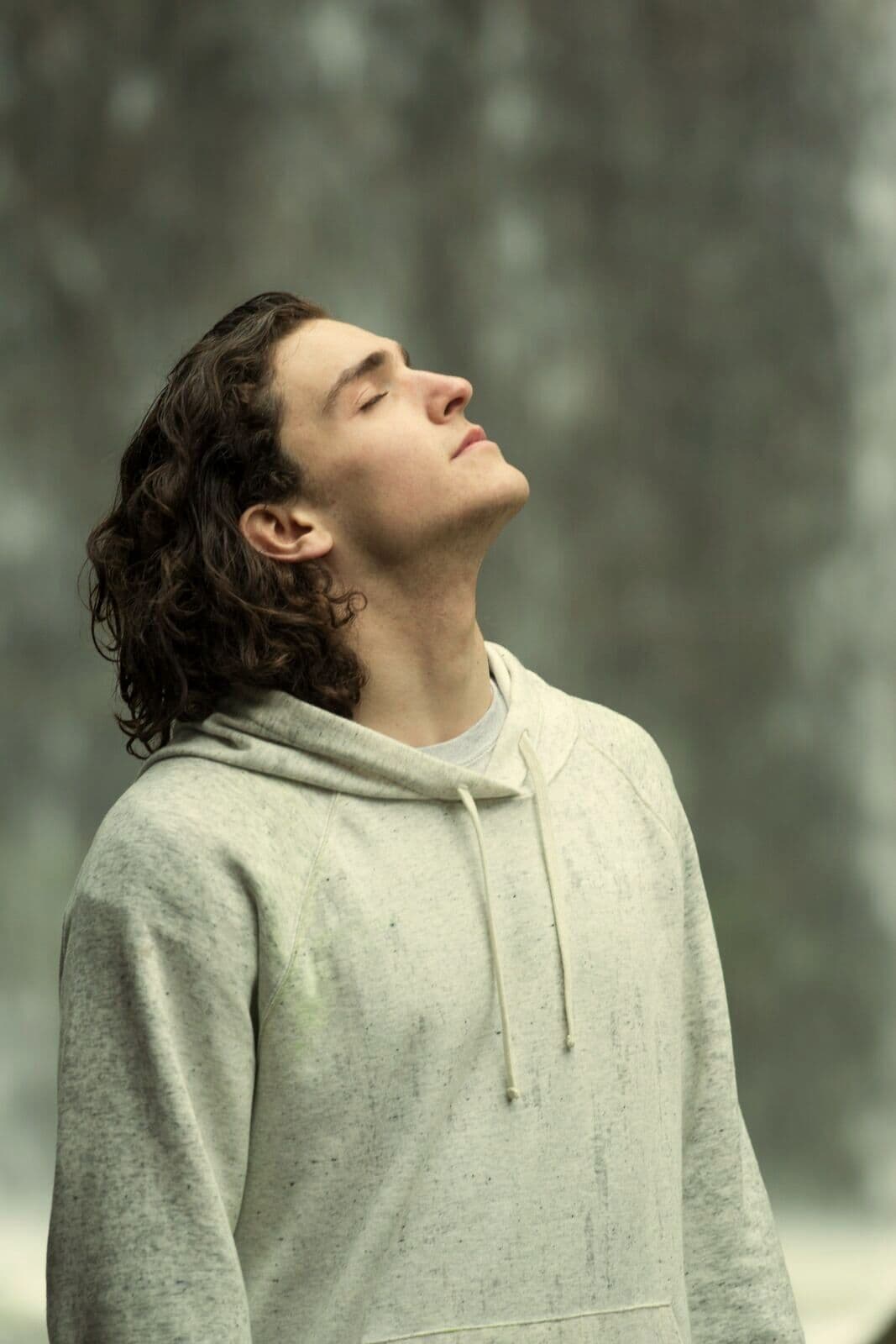 A man breathing slowly with his eyes closed